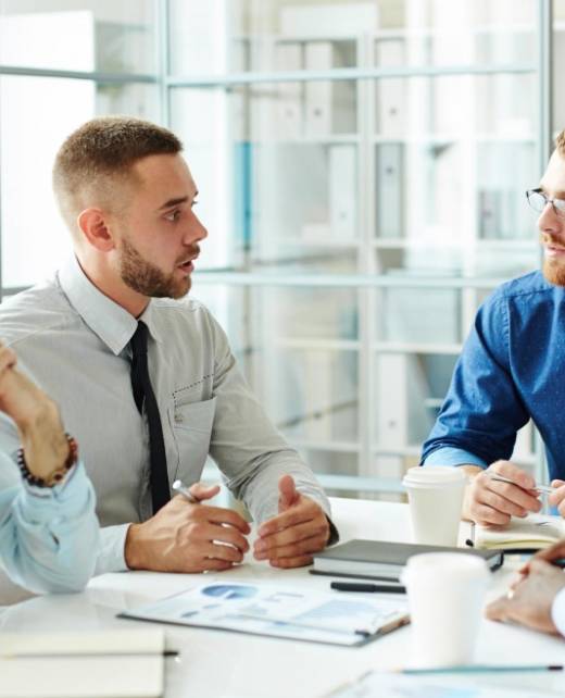 Business professionals in discussion about insolvency law and corporate rescue strategies at SWVG Inc.