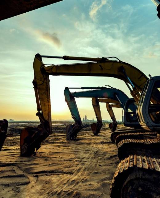 Excavators on a mining site at sunset, symbolising SWVG Inc.'s legal expertise in South African mining law, safety compliance, and mineral rights transactions.