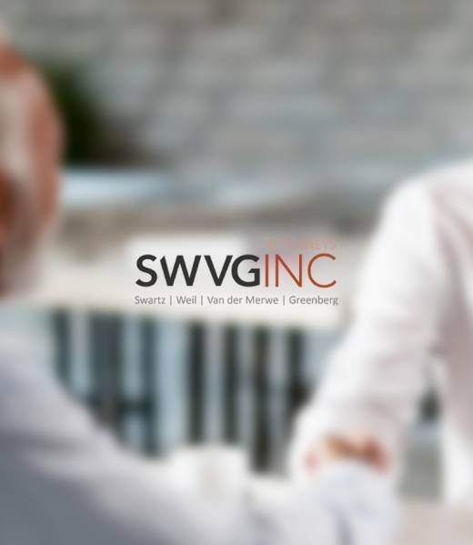 Two people shaking hands in a business meeting, symbolising negotiation, mediation and arbitration to resolve disputes.